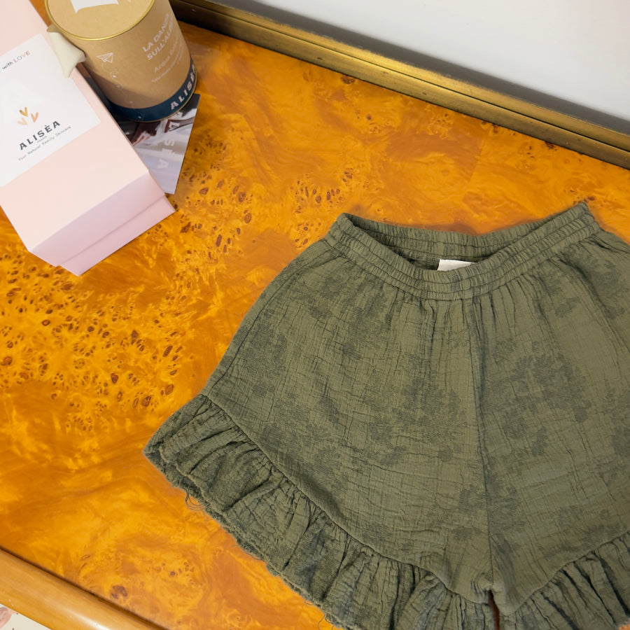 Pantaloncini in mussola di cotone foresta  con fiori tono su tono e ruches