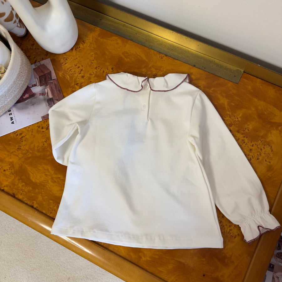 Blusa latte in cotone felpato con colletto bordato borgogna
