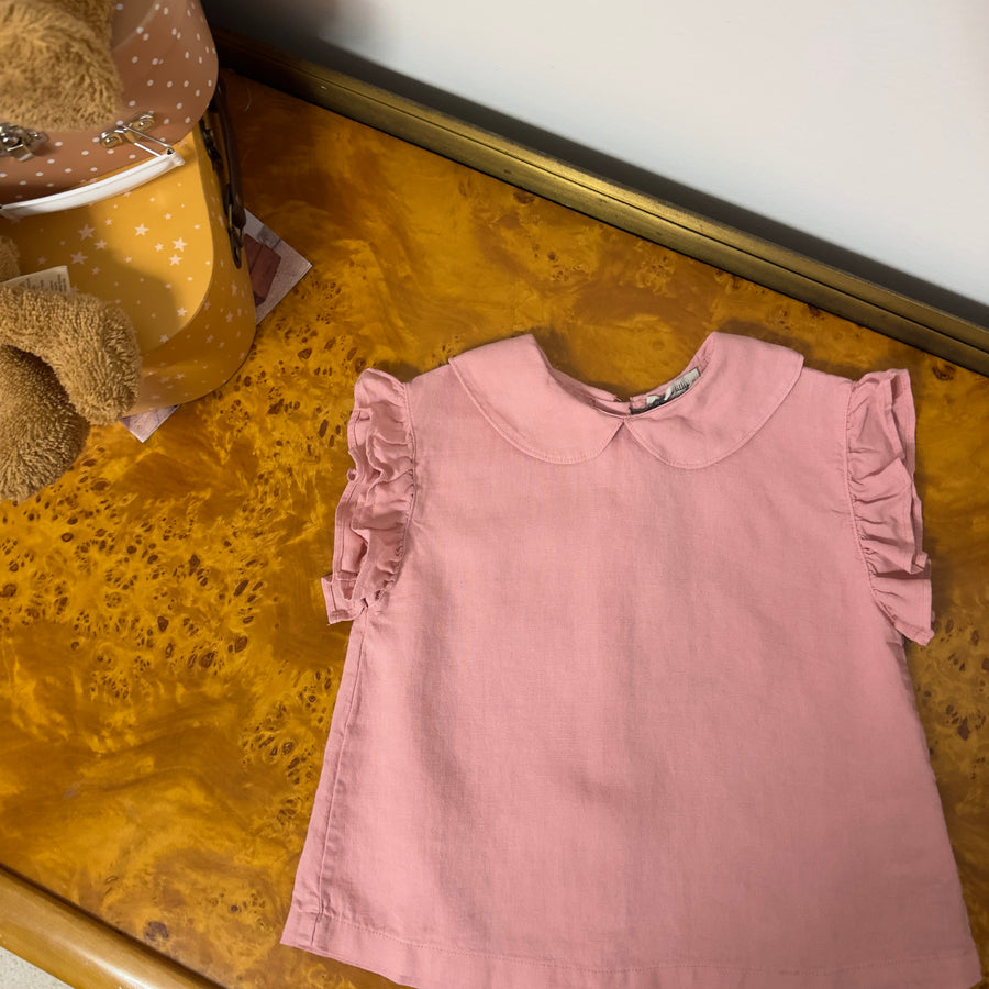 Blusa pink raffinata con bottoncini sul retro e ruches – Elegante e versatile