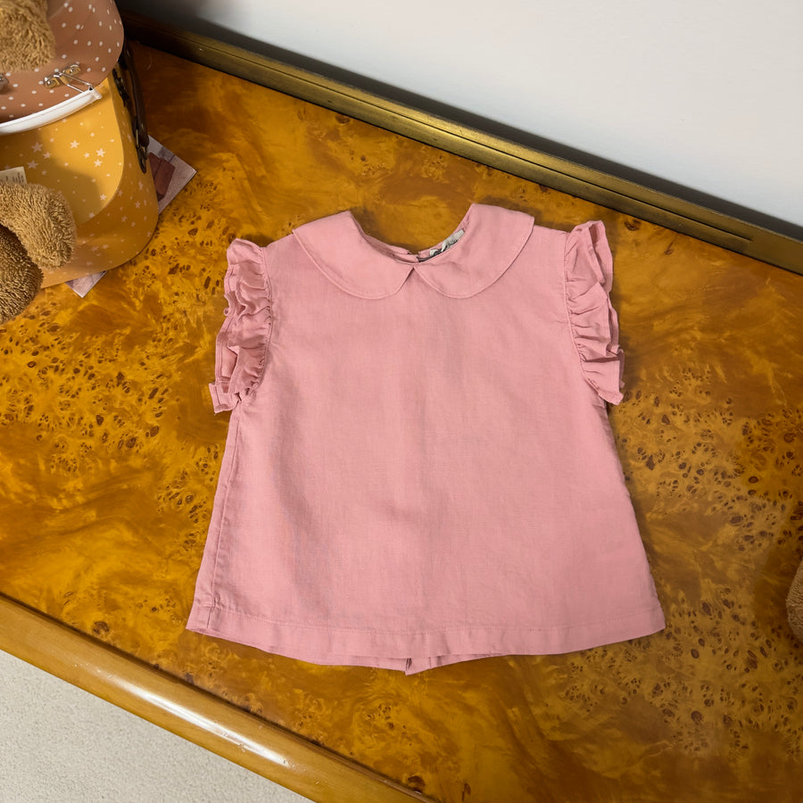 Blusa pink raffinata con bottoncini sul retro e ruches – Elegante e versatile