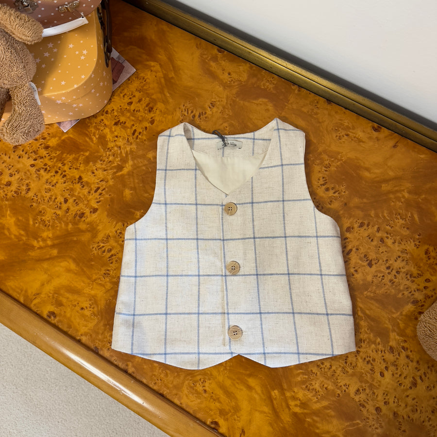 Gilet beige con quadri azzurri –elegante e versatile