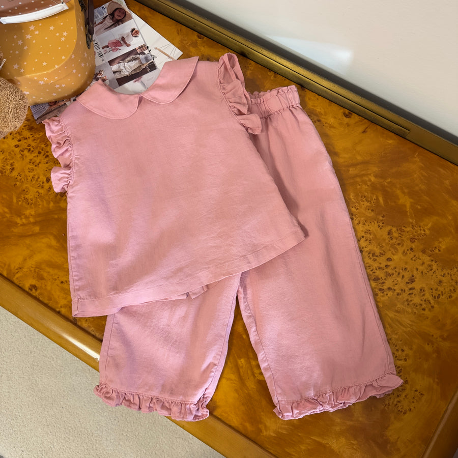 Blusa pink raffinata con bottoncini sul retro e ruches – Elegante e versatile