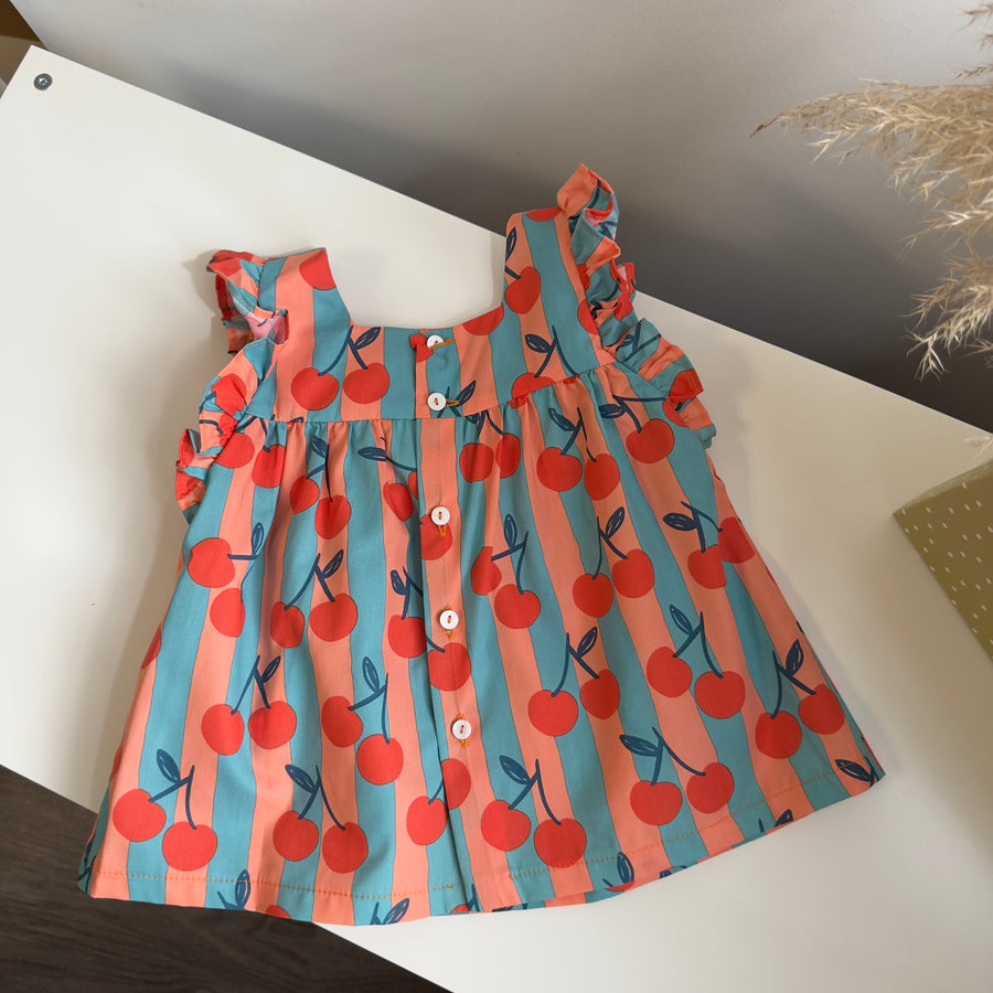 Blusa artigianale a righe con ciliegie – linea ampia e dettagli curati