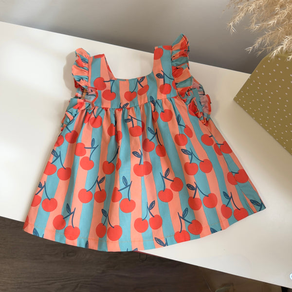 Blusa artigianale a righe con ciliegie – linea ampia e dettagli curati