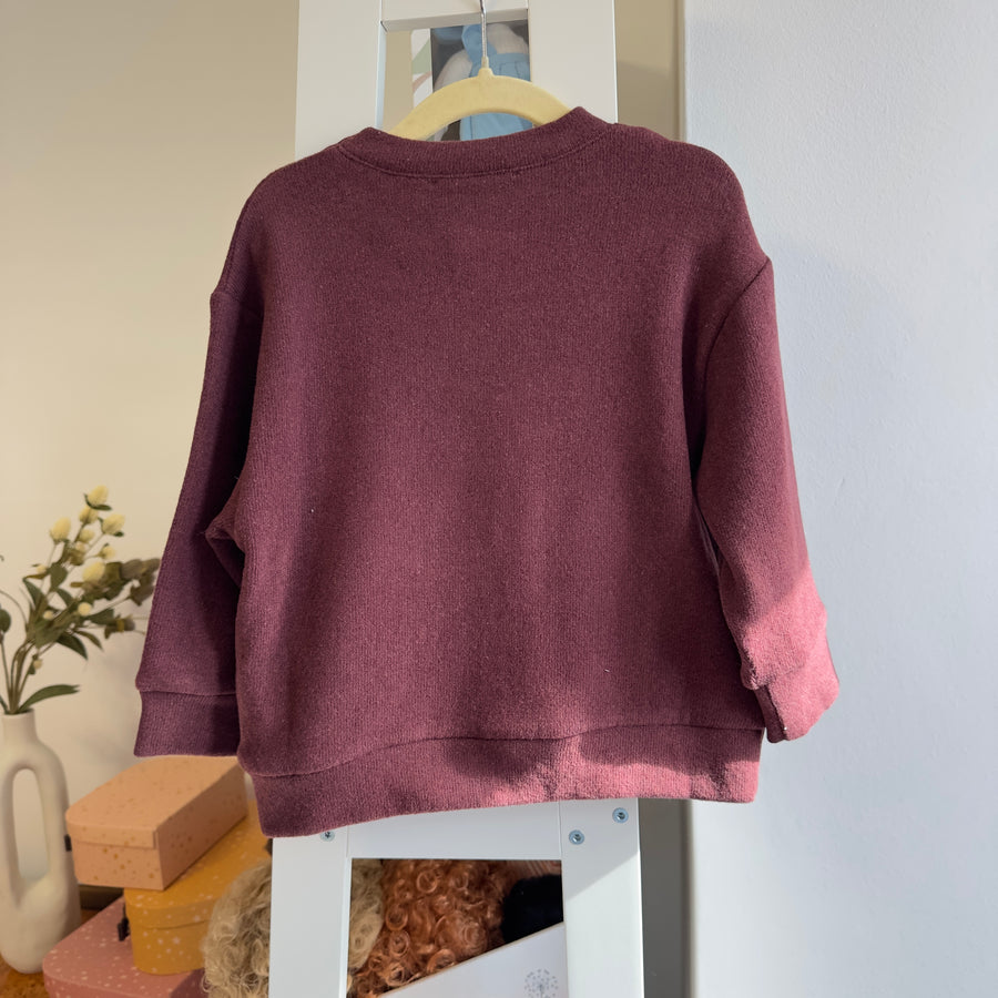 Maglia in caldo cotone borgogna con  tasche frontali a cuore