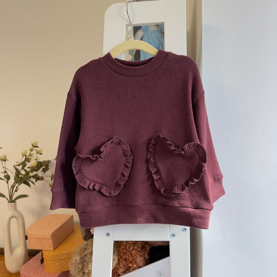 Maglia in caldo cotone borgogna con  tasche frontali a cuore