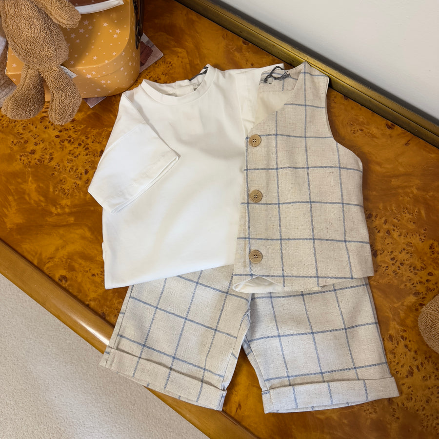 T-shirt basica color latte in jersey di cotone elasticizzato con taschino e bottoni sul retro