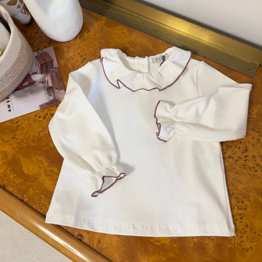Blusa latte in cotone felpato con colletto bordato borgogna