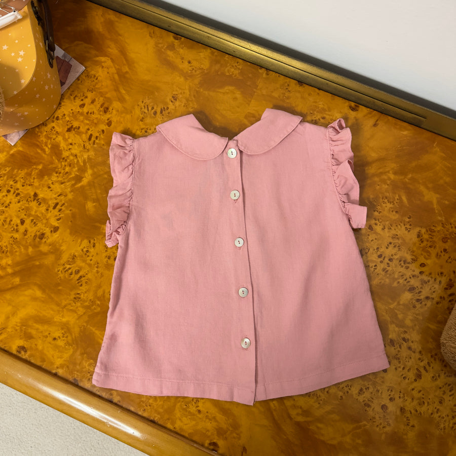 Blusa pink raffinata con bottoncini sul retro e ruches – Elegante e versatile